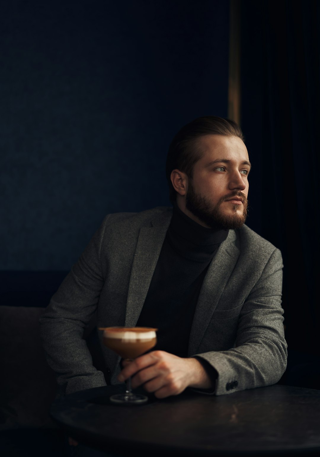Studio portrait of a white British man with a beard