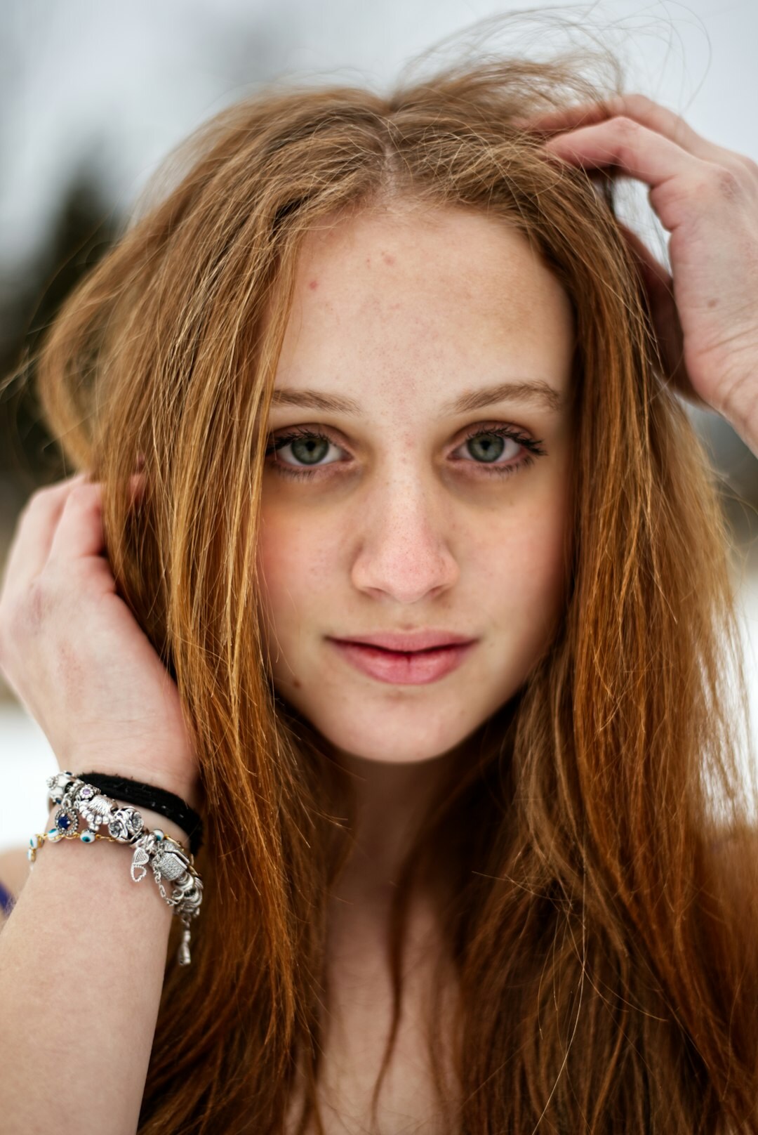 Studio portrait of a white British woman with red hair