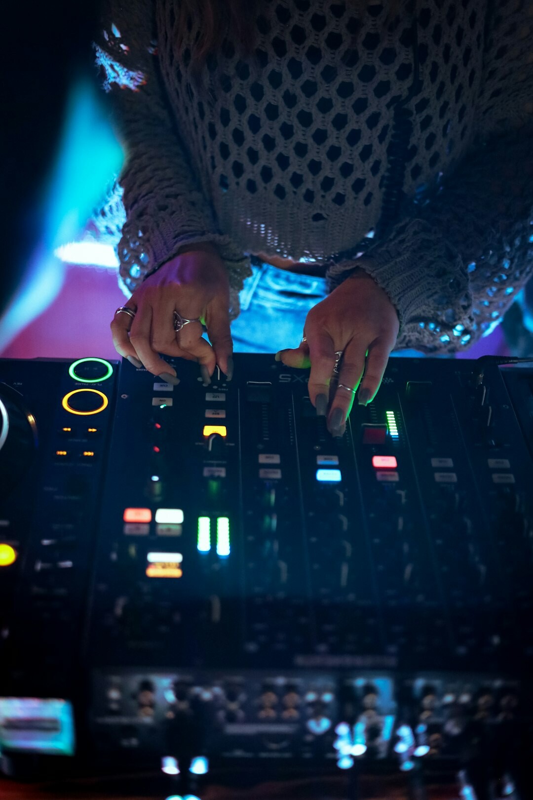 Technician operating a live broadcast vision mixer desk
